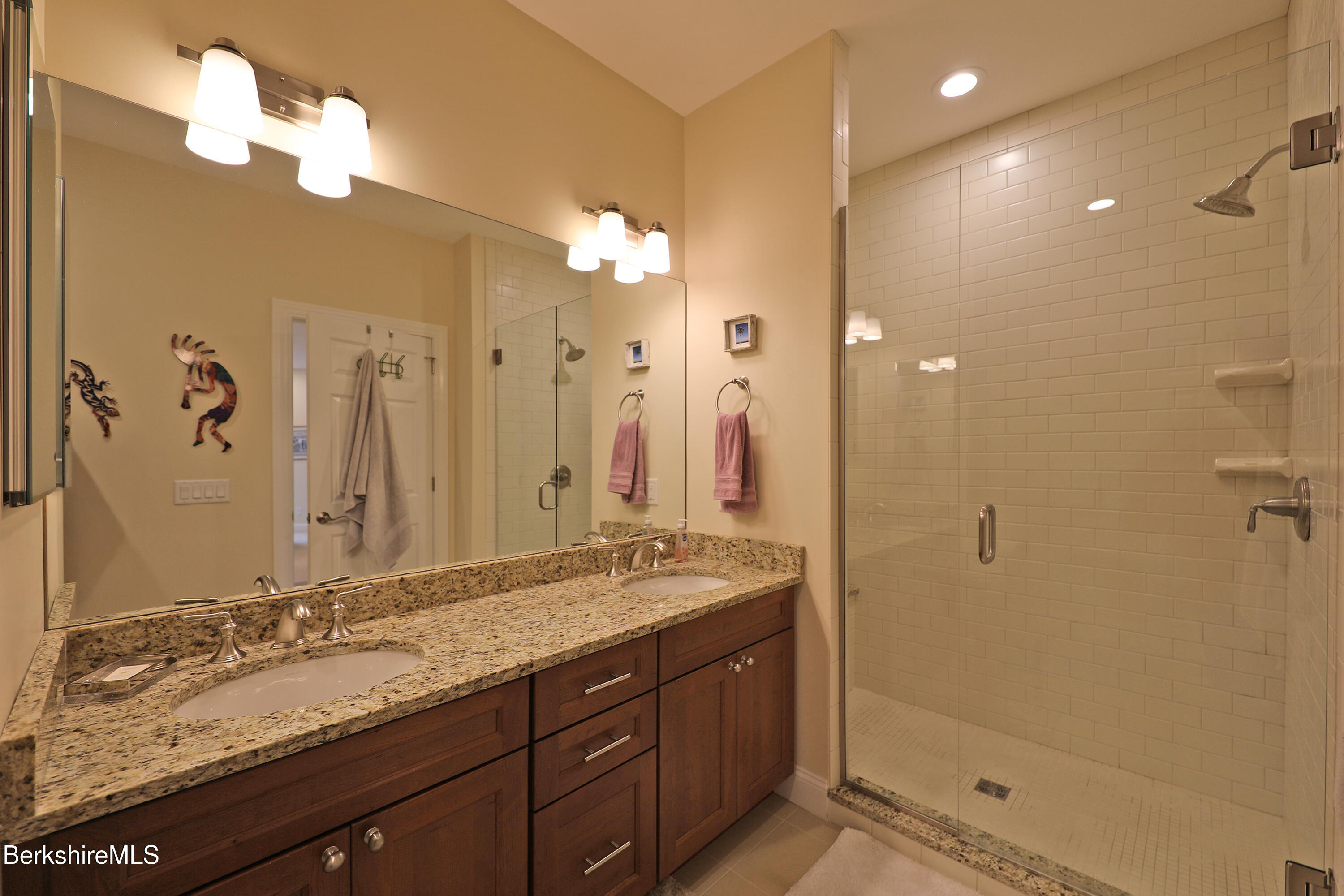 127 Alpine Trail Pittsfield, MA 01201 - Photo 25 of 54 a bathroom with a granite countertop sink a mirror and a shower