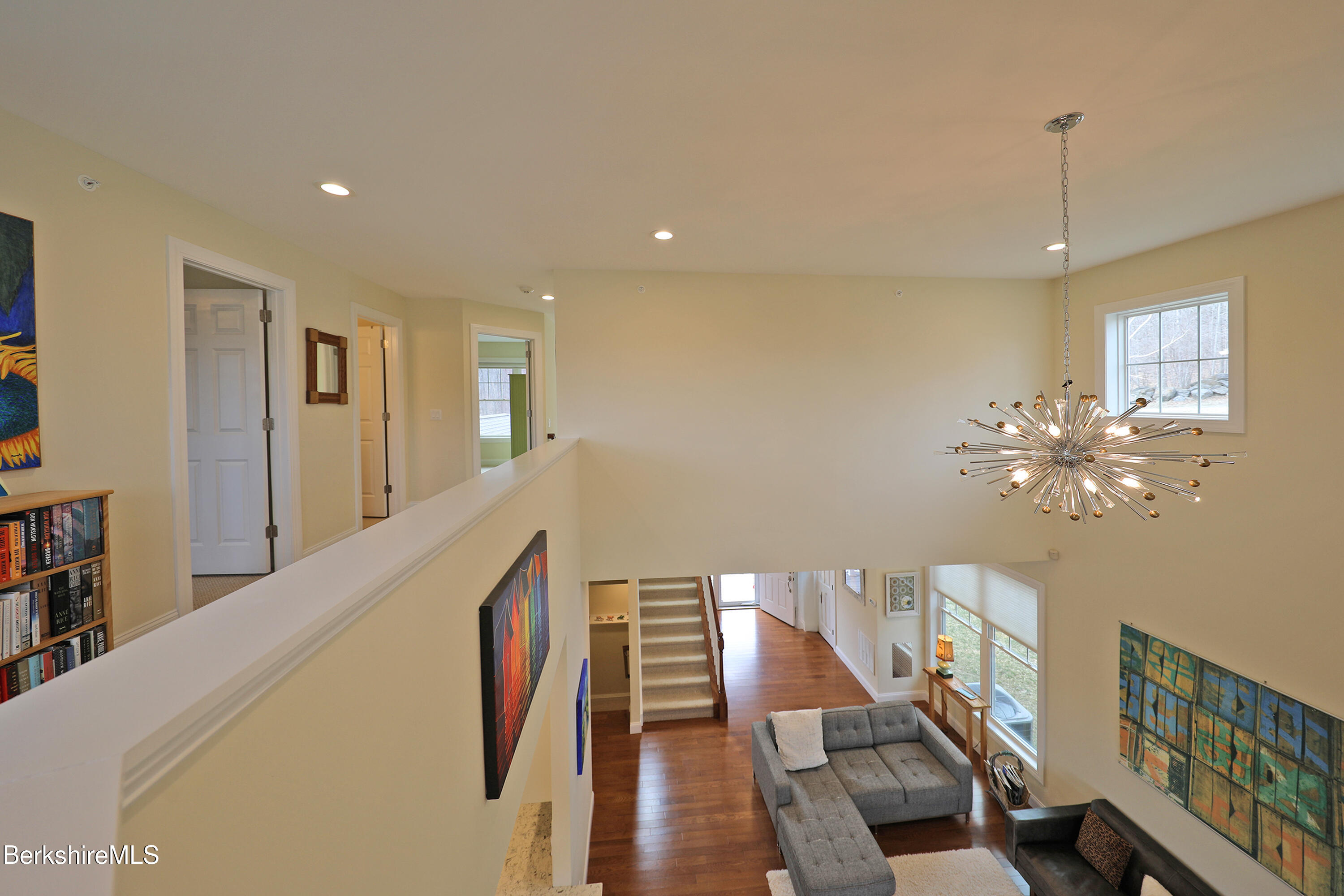 127 Alpine Trail Pittsfield, MA 01201 - Photo 31 of 54 a view of a hallway with wooden floor and staircase
