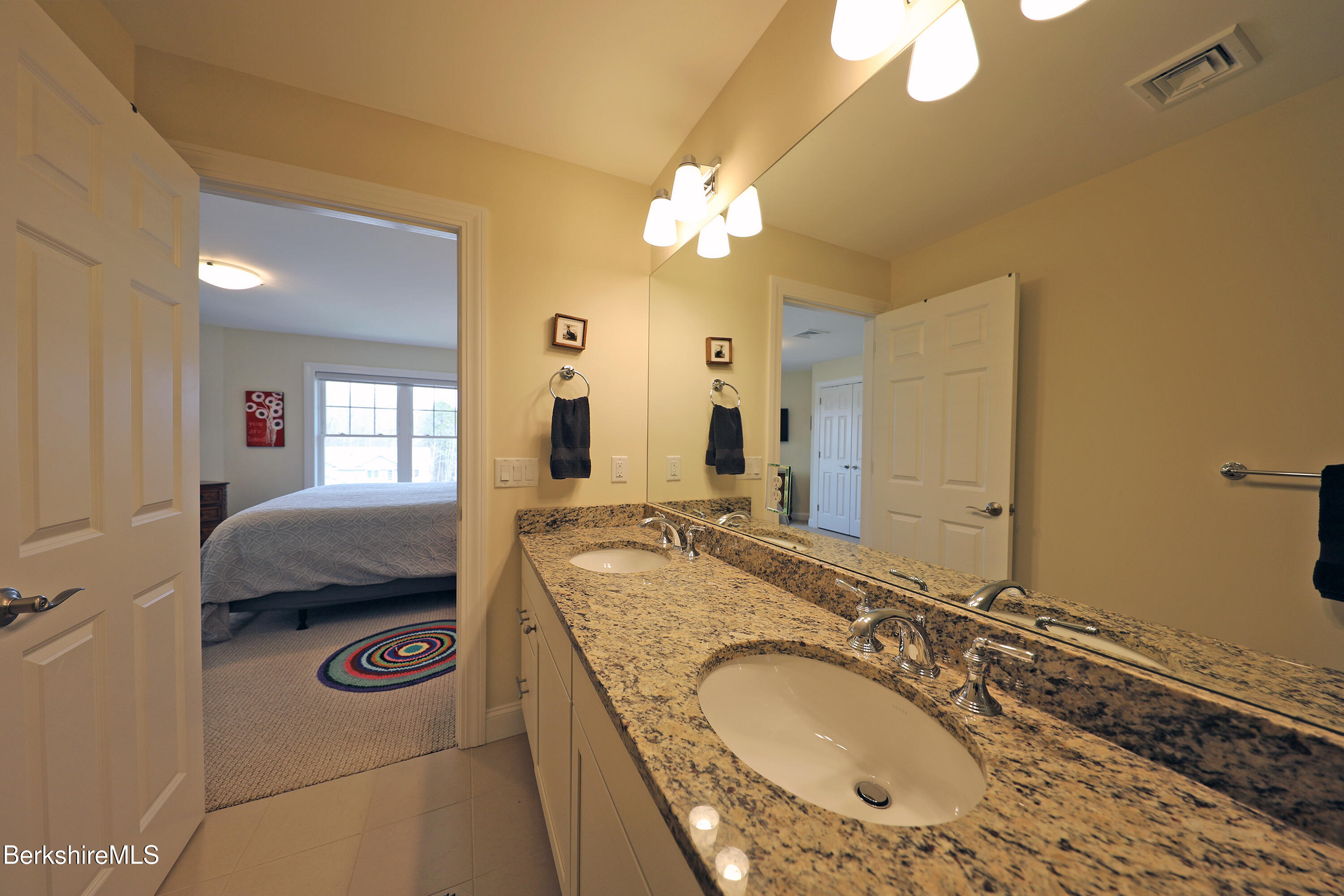 127 Alpine Trail Pittsfield, MA 01201 - Photo 39 of 54 a en suite bathroom with a granite countertop double vanity sink and a mirror