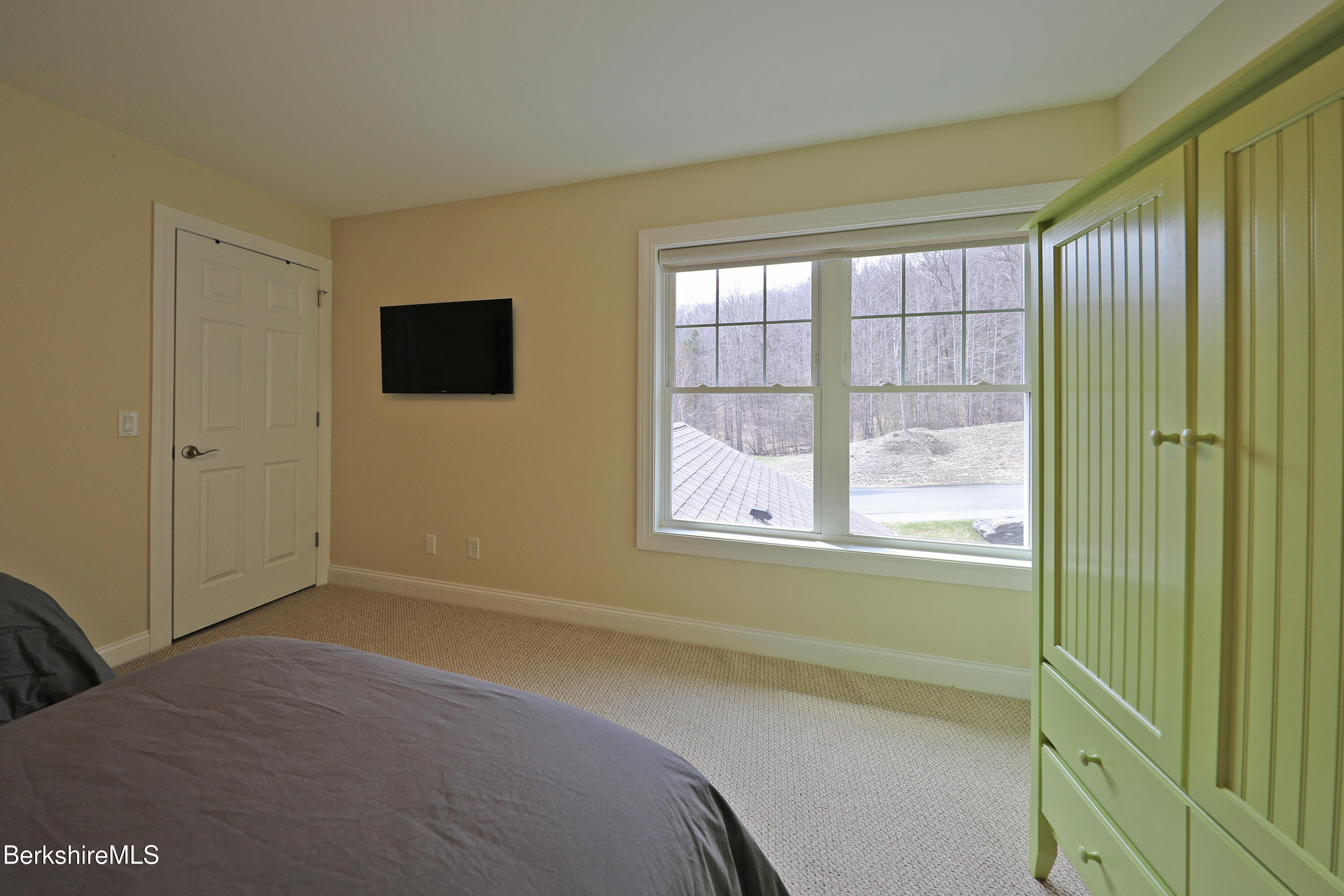 127 Alpine Trail Pittsfield, MA 01201 - Photo 43 of 54 a room with a bed and a flat screen tv