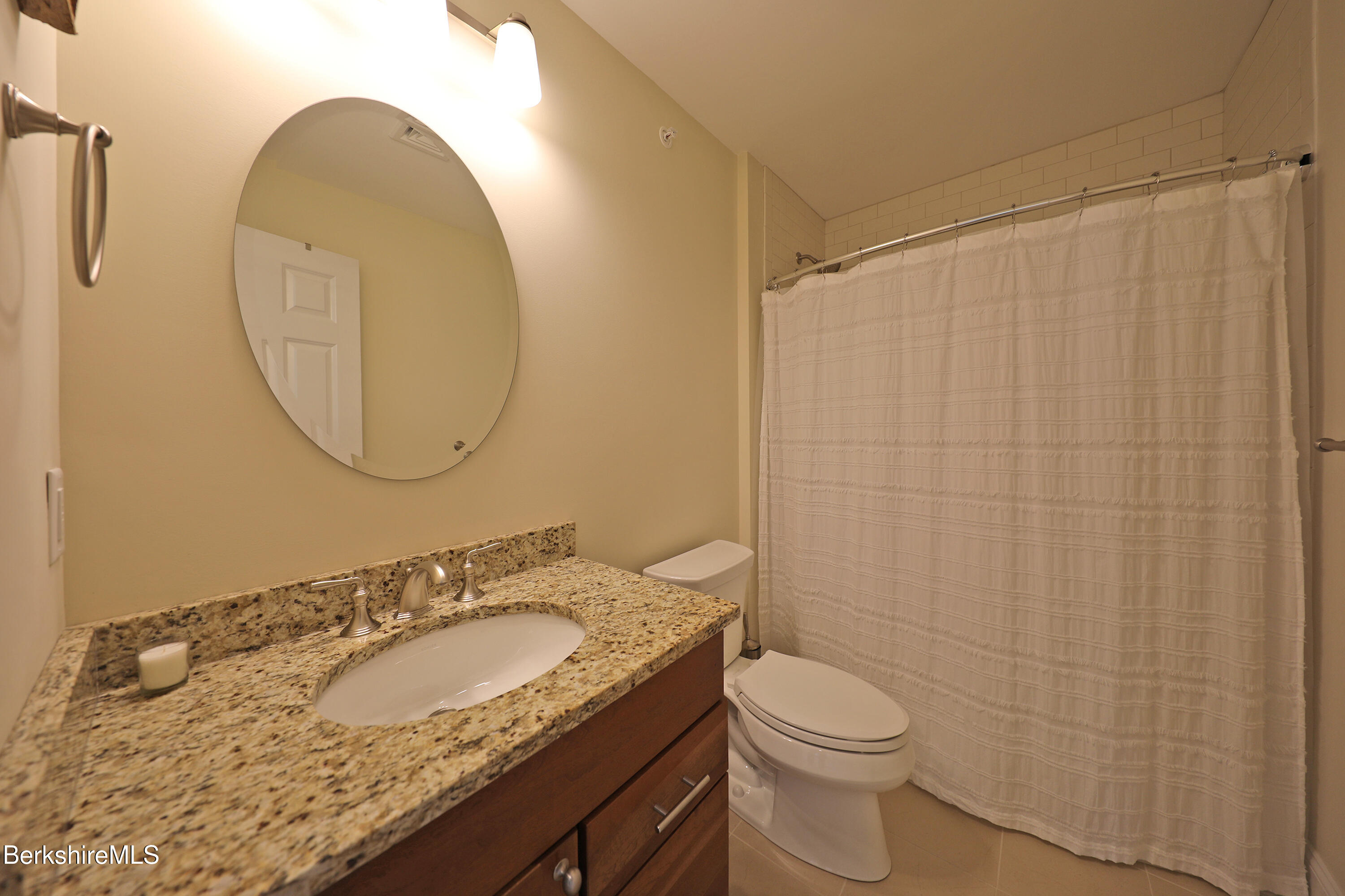 127 Alpine Trail Pittsfield, MA 01201 - Photo 44 of 54 a bathroom with a granite countertop sink and a mirror
