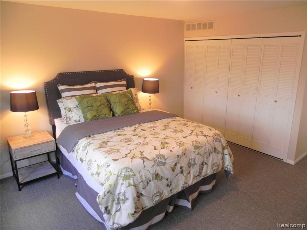 23189 Farmington Road Farmington, MI 48336 - Photo 17 of 29 Sensational, spacious master suite - four closets, en-suite bathroom and balcony w/nature views