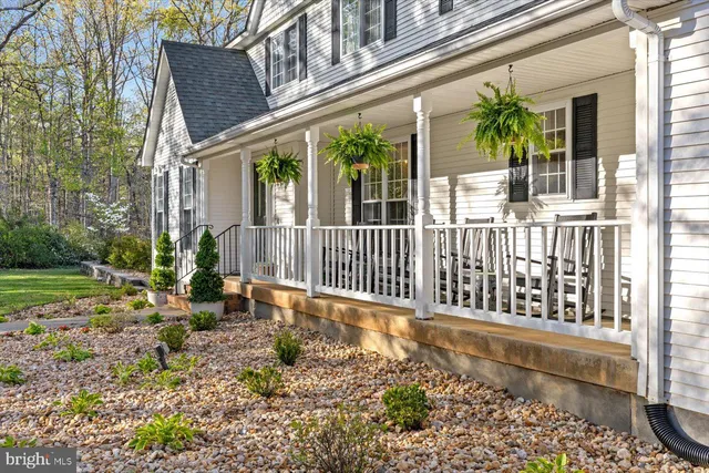 a kitchen with white cabinets sink and stainless steel appliances