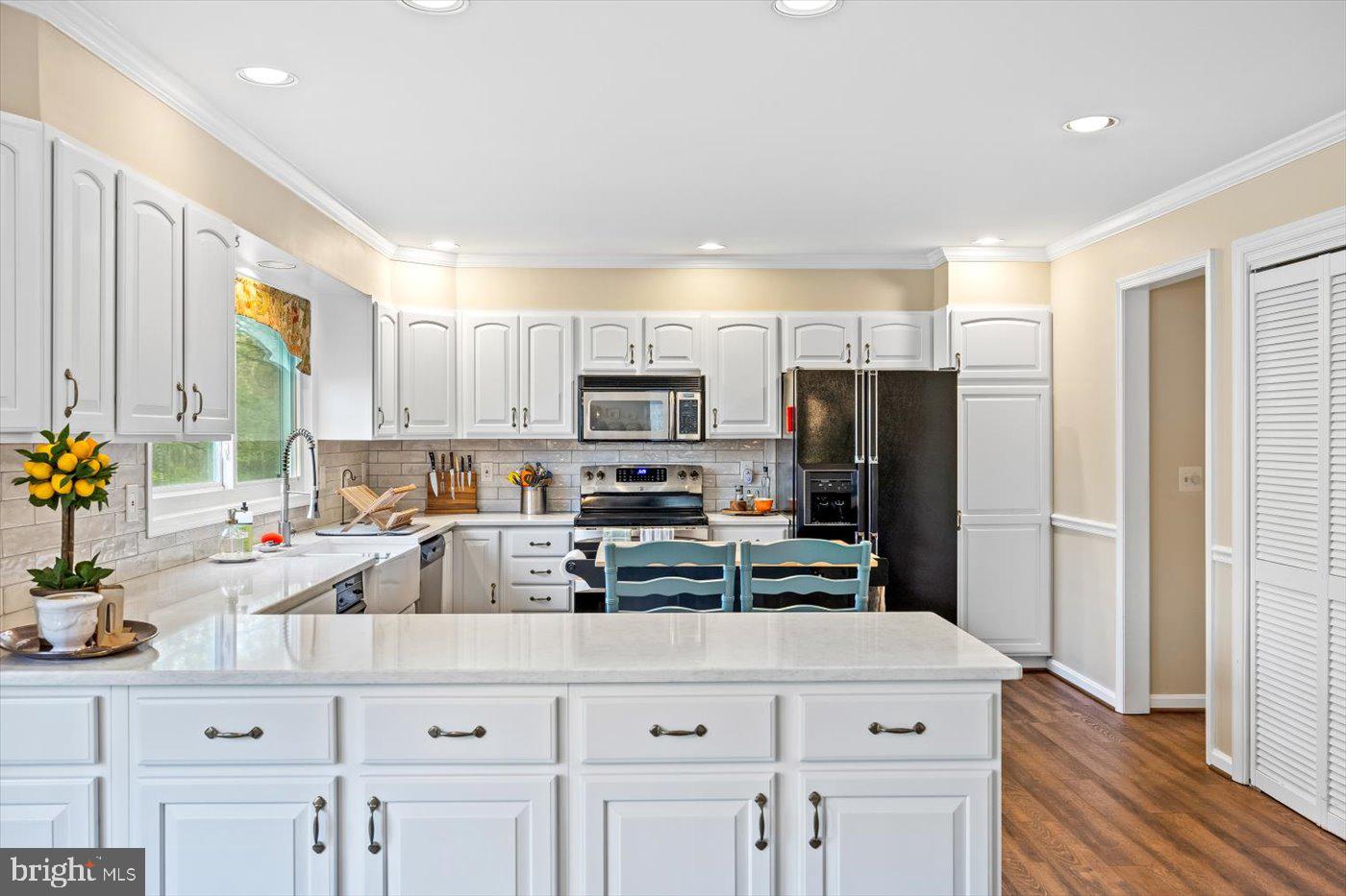 13037 Orange Plank Road Locust Grove, VA 22508 - Photo 20 of 71 a kitchen with appliances a sink cabinets and a counter top space