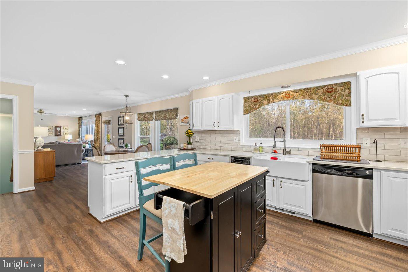 13037 Orange Plank Road Locust Grove, VA 22508 - Photo 23 of 71 a kitchen with a sink a counter top space and stainless steel appliances