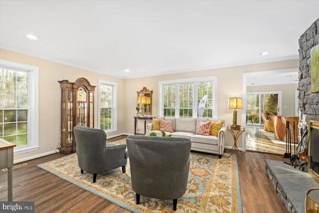 a bathroom with a granite countertop sink a large mirror and a shower