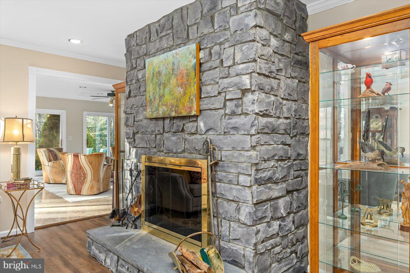 13037 Orange Plank Road Locust Grove, VA 22508 - Photo 31 of 71 a living room with a wooden floor and a fireplace
