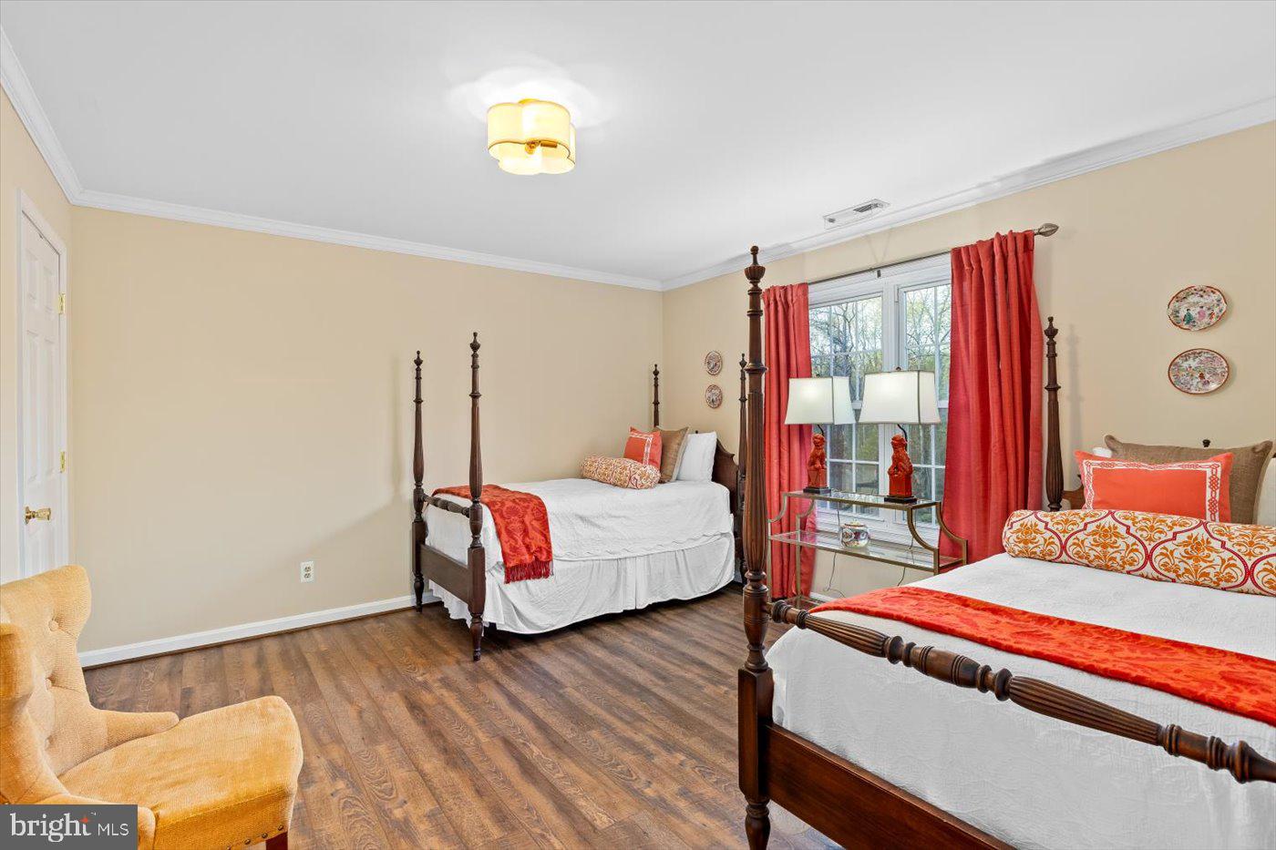 13037 Orange Plank Road Locust Grove, VA 22508 - Photo 39 of 71 a bedroom with a bed and wooden floor