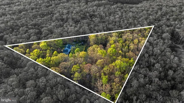 a front view of a building with trees