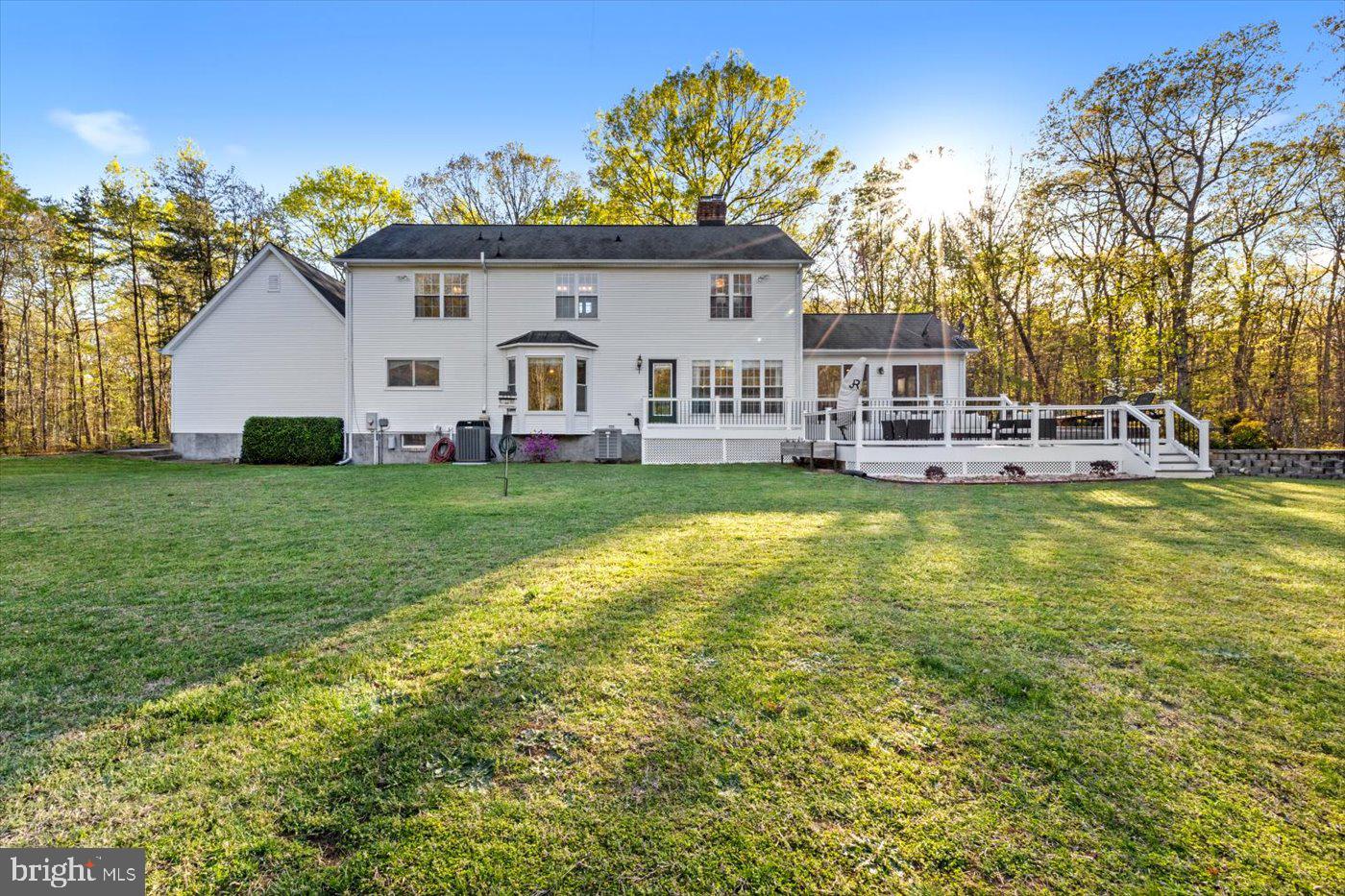 13037 Orange Plank Road Locust Grove, VA 22508 - Photo 51 of 71 a view of a house with a big yard and large trees
