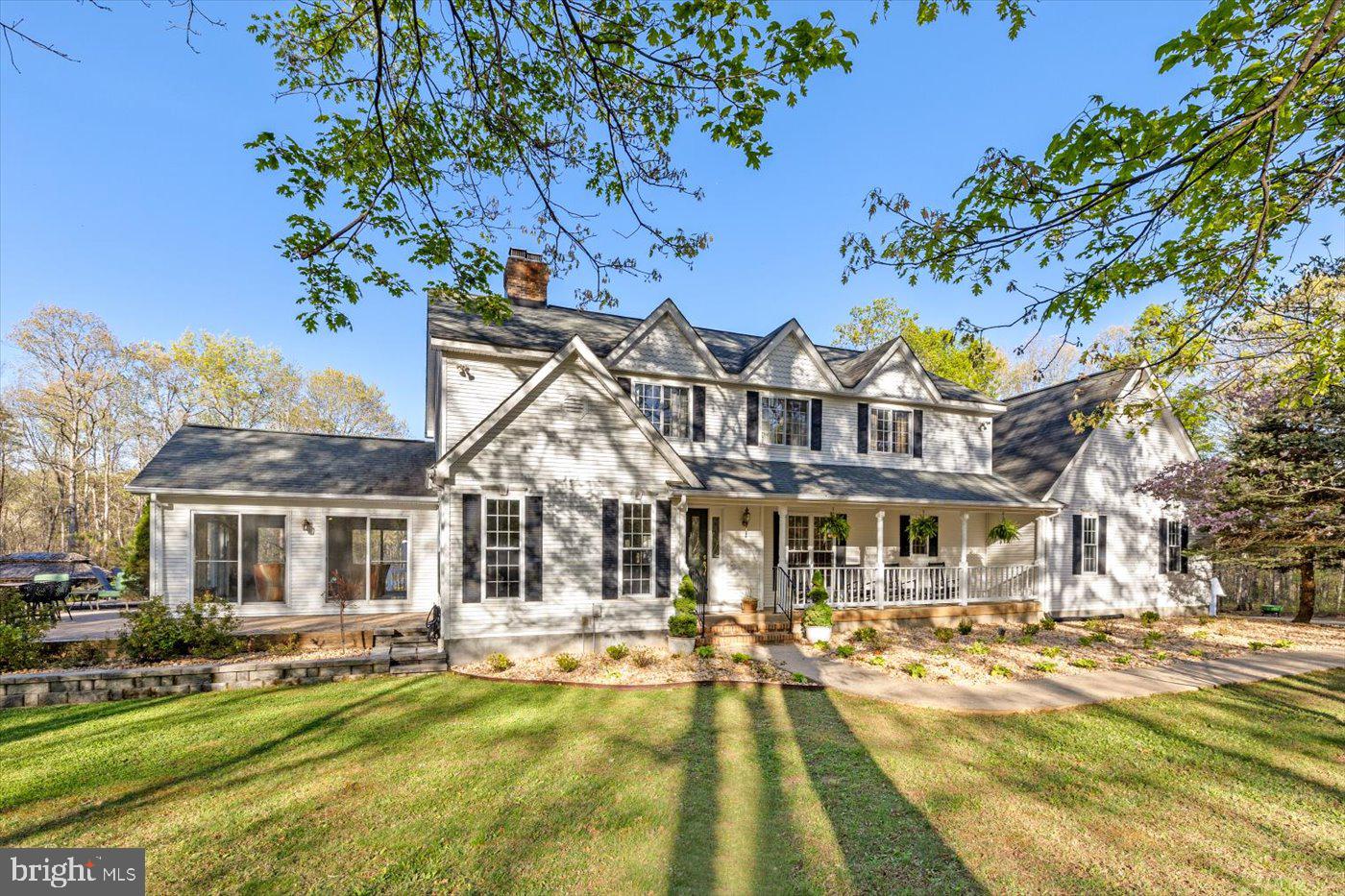 13037 Orange Plank Road Locust Grove, VA 22508 - Photo 7 of 71 a front view of a building with swimming pool