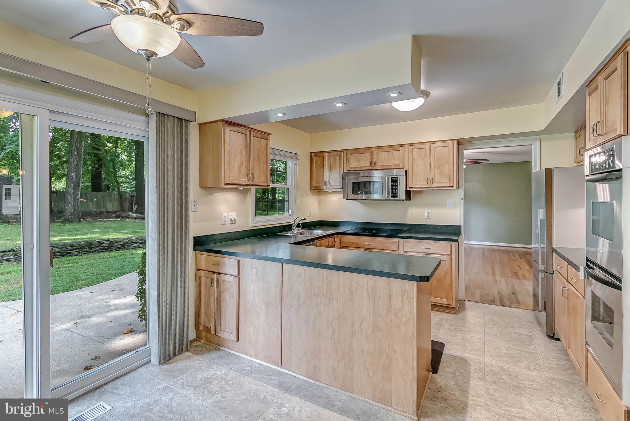 2908 Bluff Point Lane Silver Spring, MD 20906 - Photo 7 of 63 Updated kitchen with exit to patio