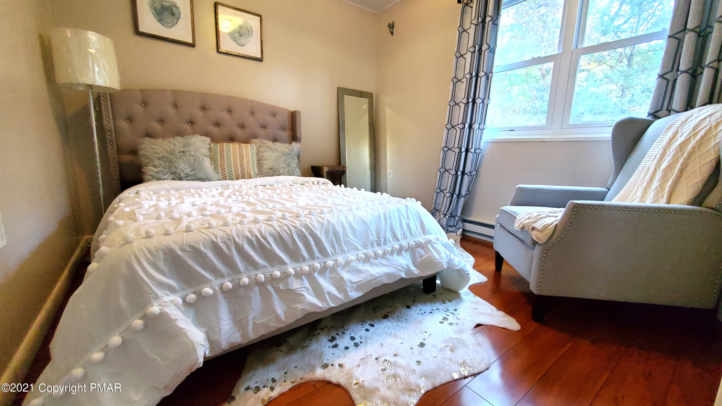 2111 Southport Drive Bushkill, PA 18324 - Photo 11 of 30 a bedroom with a bed and wooden floor