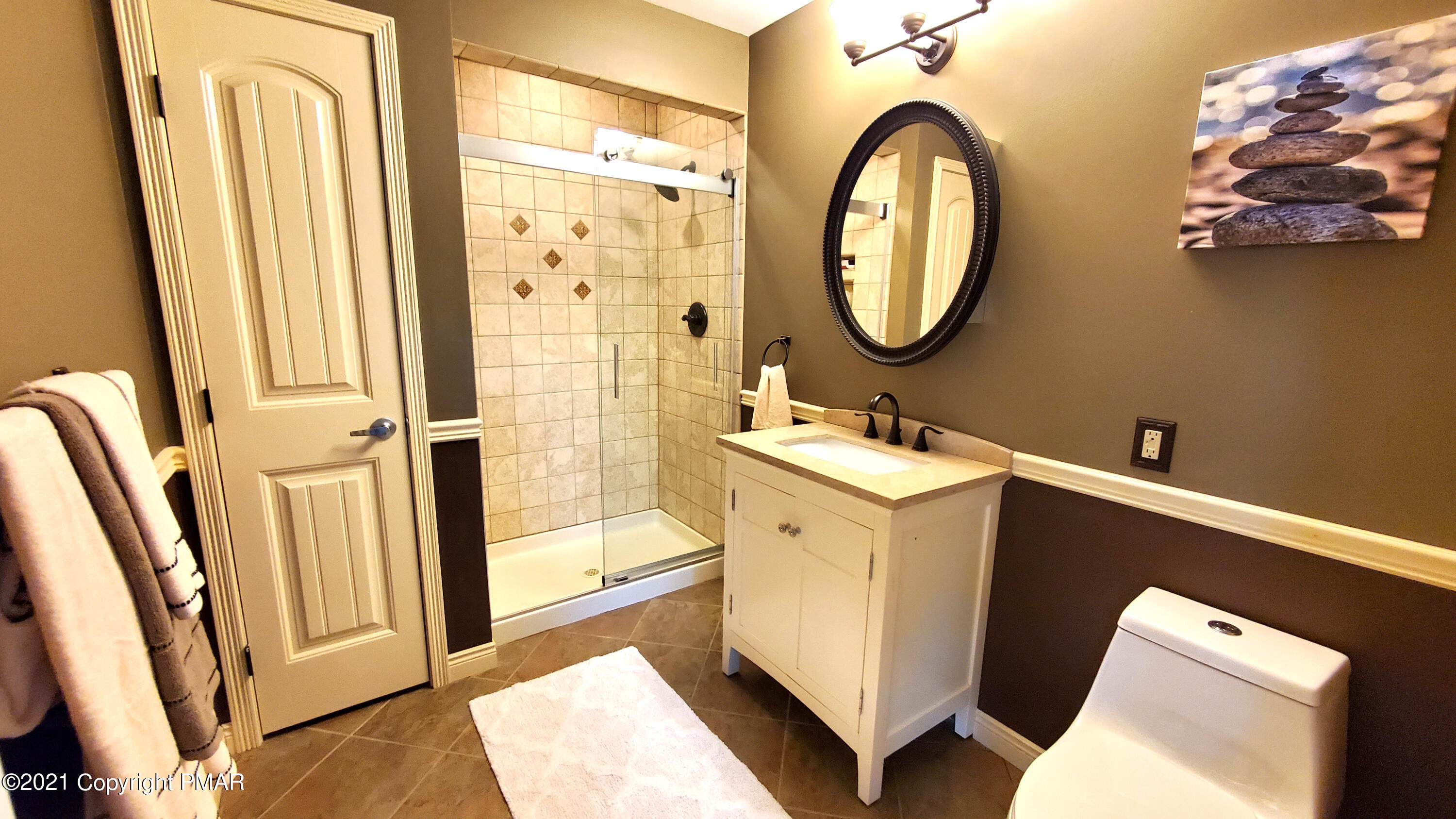 2111 Southport Drive Bushkill, PA 18324 - Photo 12 of 30 a bathroom with a sink a mirror a vanity and a shower