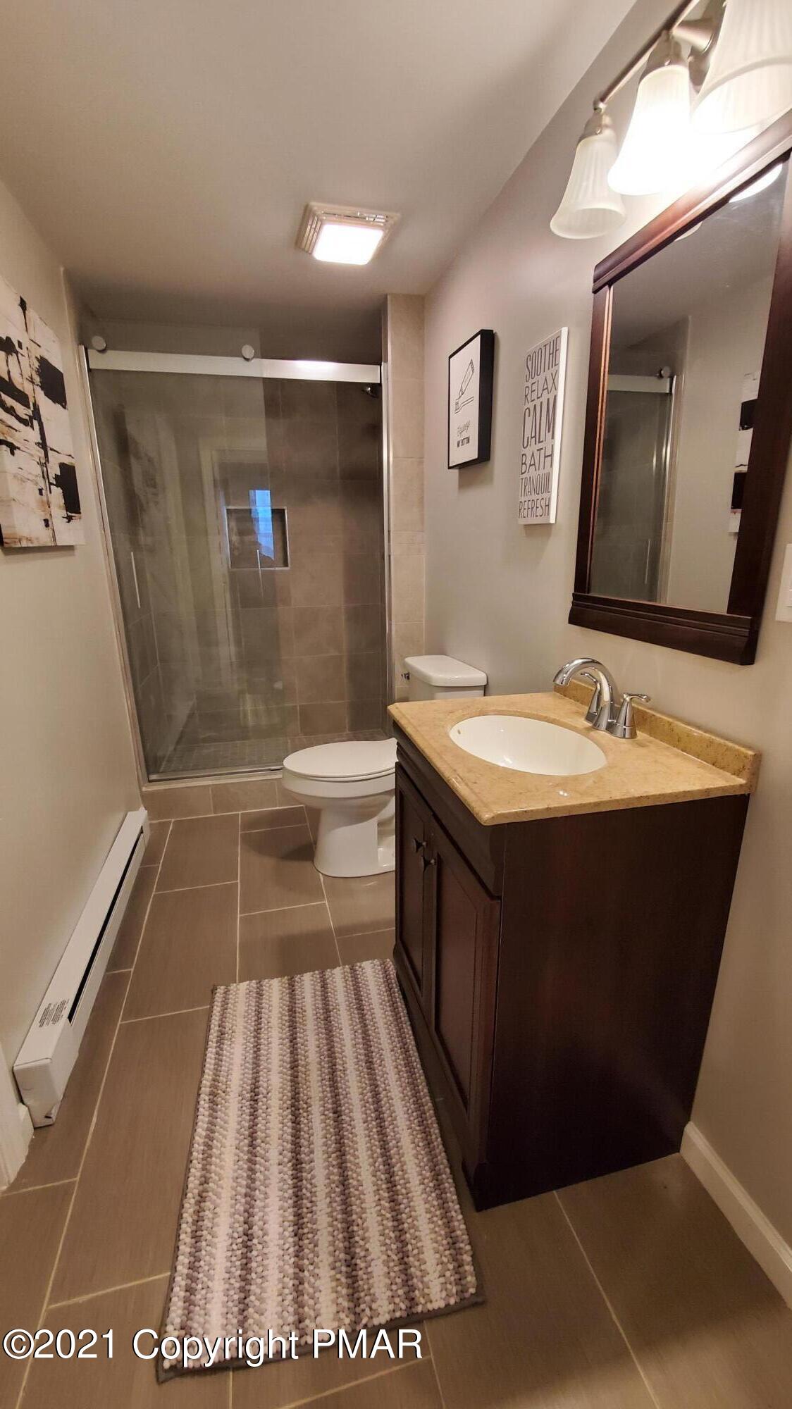 2111 Southport Drive Bushkill, PA 18324 - Photo 14 of 30 a bathroom with a sink and a mirror