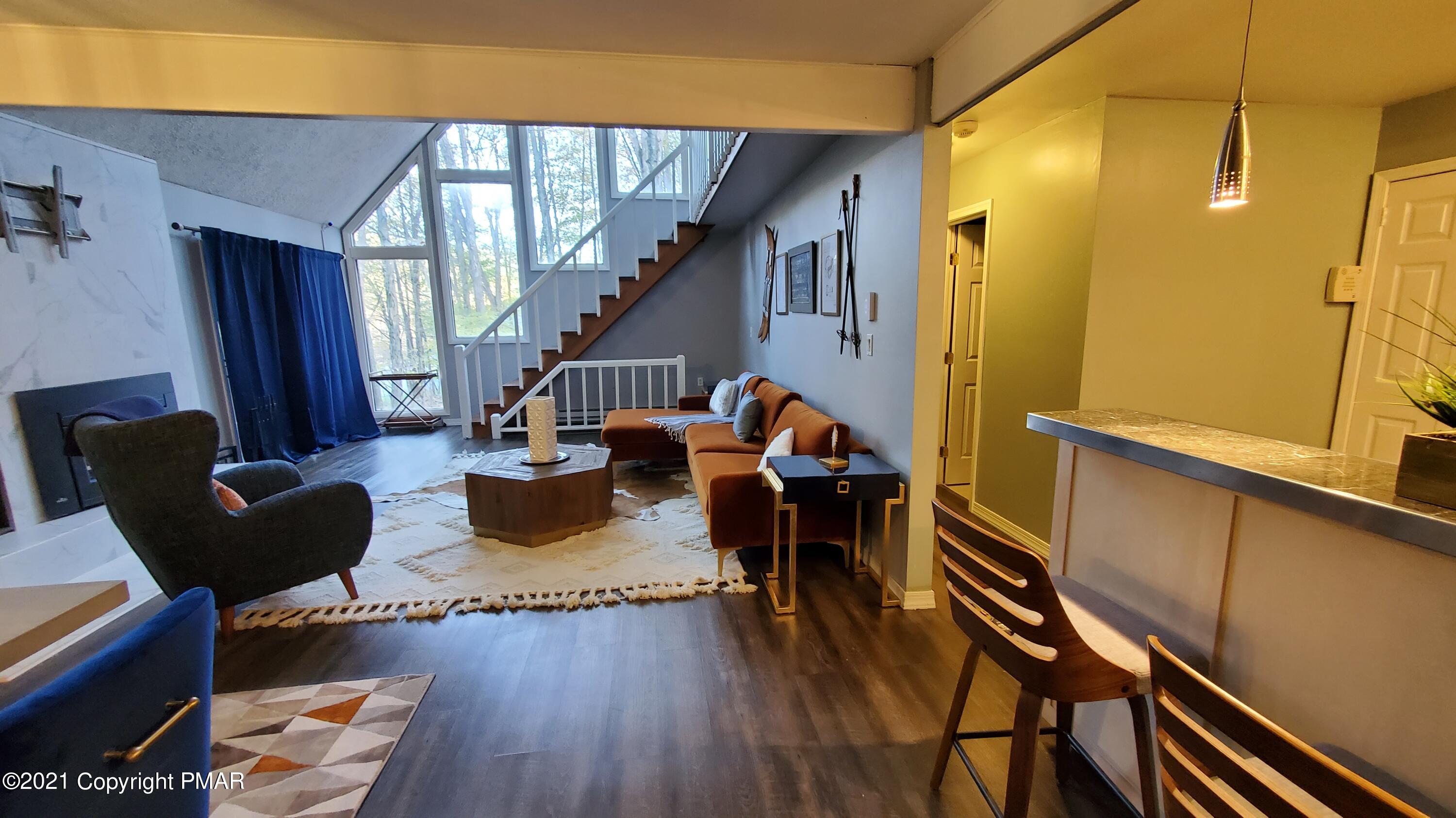 2111 Southport Drive Bushkill, PA 18324 - Photo 21 of 30 a living room with furniture and a wooden floor