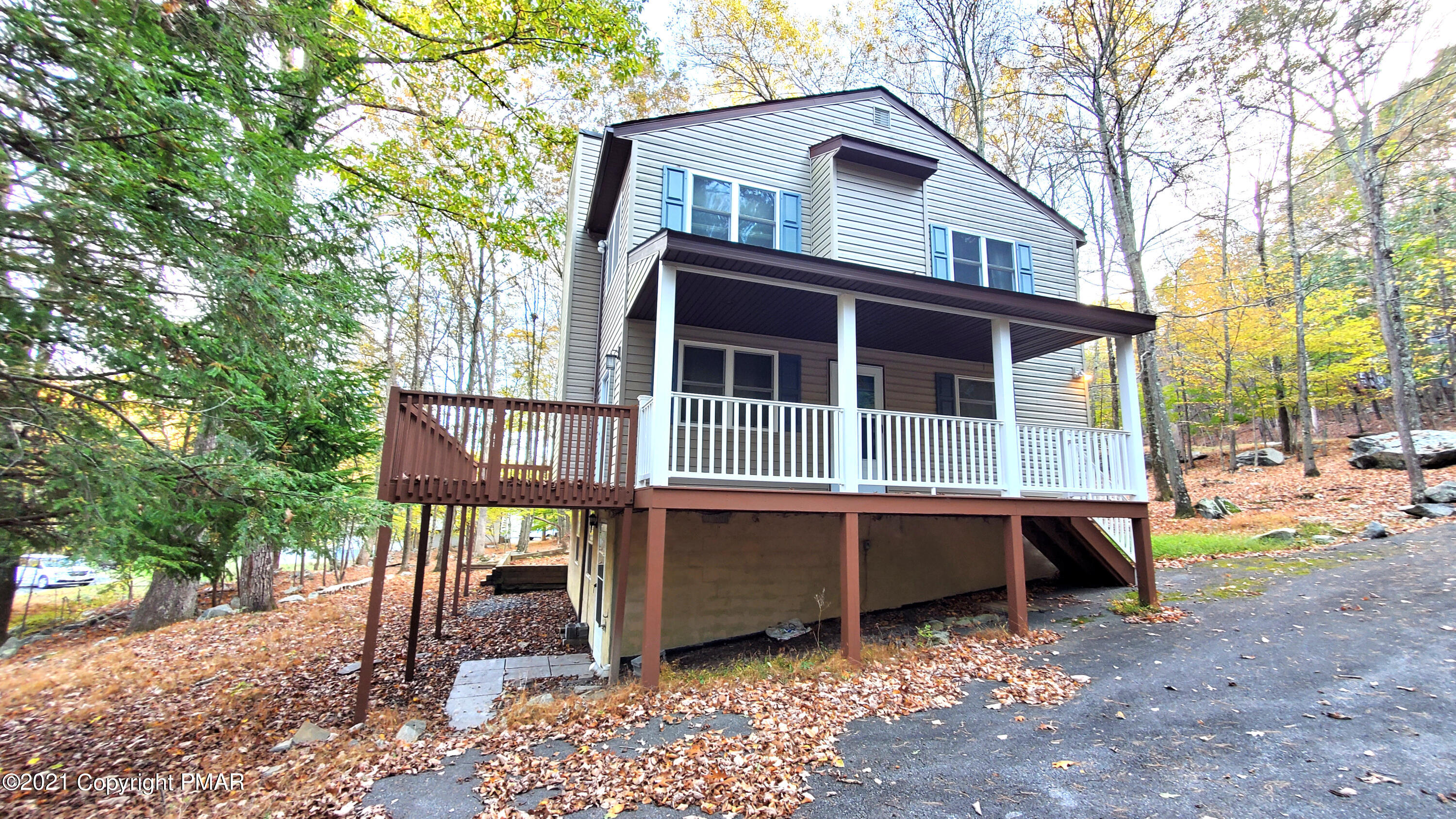 2111 Southport Drive Bushkill, PA 18324 - Photo 28 of 30 a front view of a house with a yard and balcony