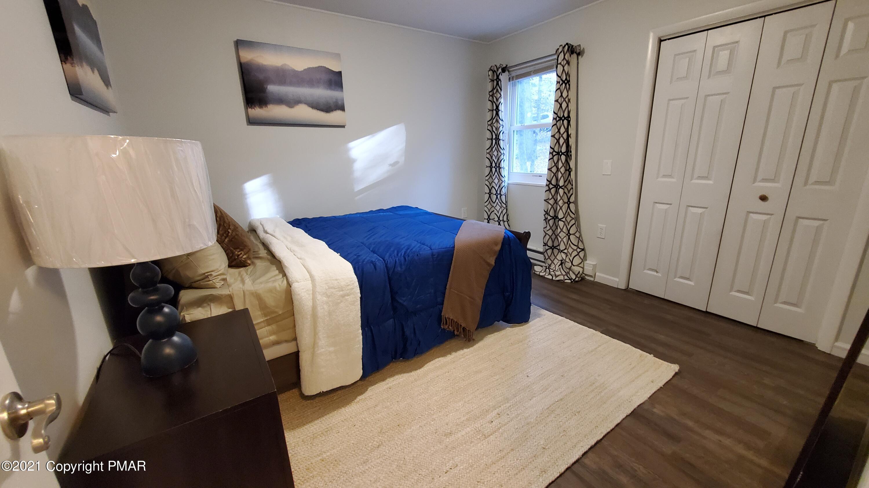 2111 Southport Drive Bushkill, PA 18324 - Photo 5 of 30 a bed room with a bed and a window