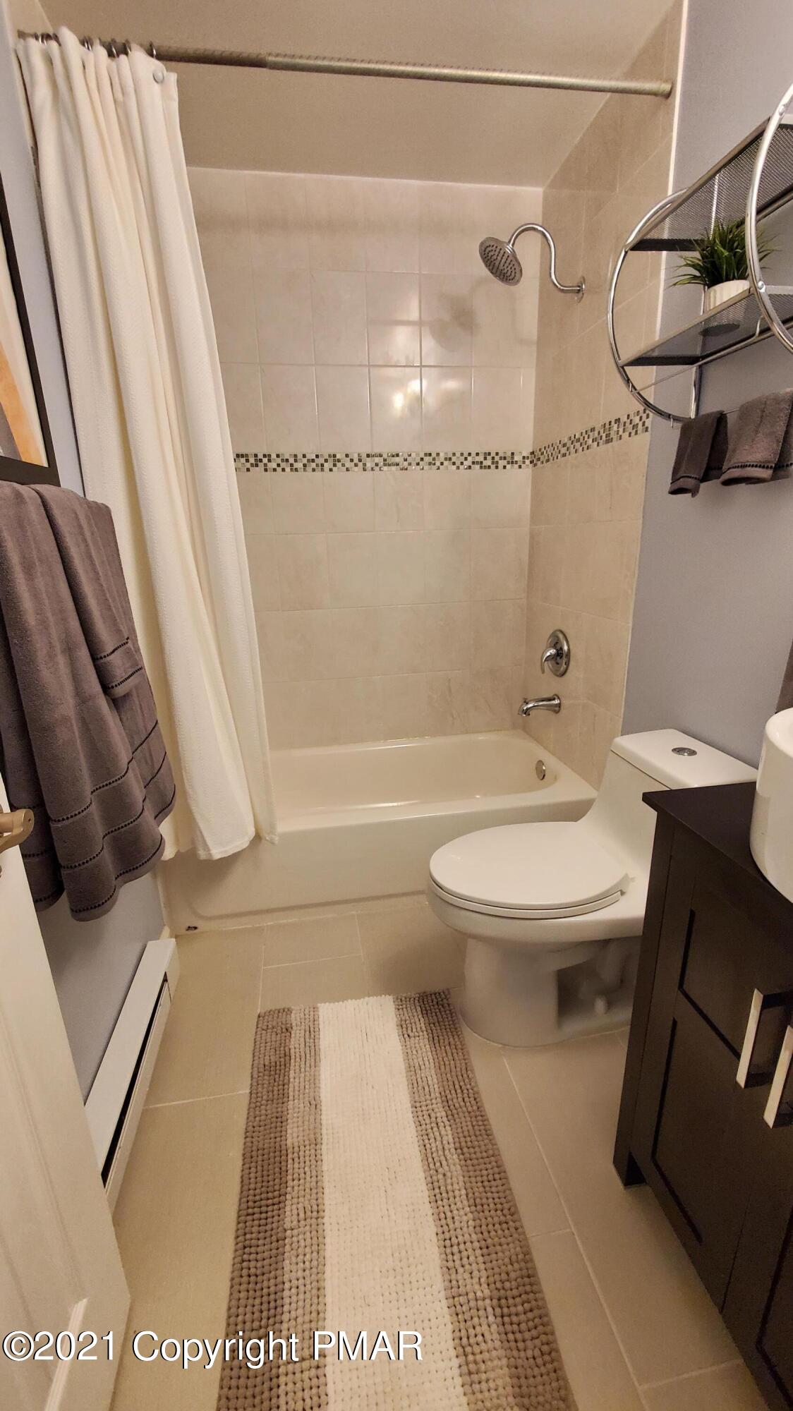 2111 Southport Drive Bushkill, PA 18324 - Photo 6 of 30 a bathroom with a toilet and a shower