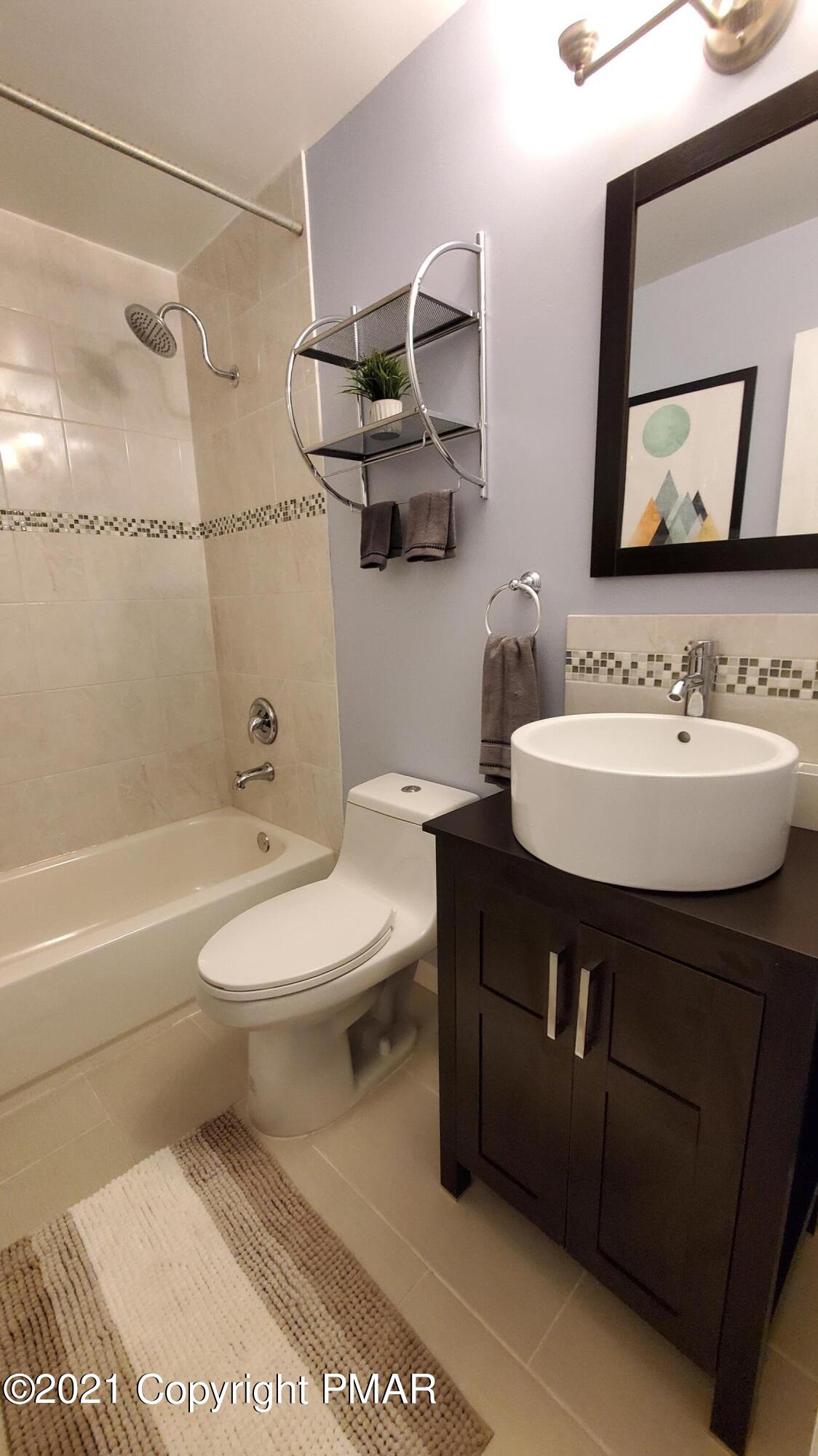 2111 Southport Drive Bushkill, PA 18324 - Photo 7 of 30 a bathroom with a sink toilet and shower