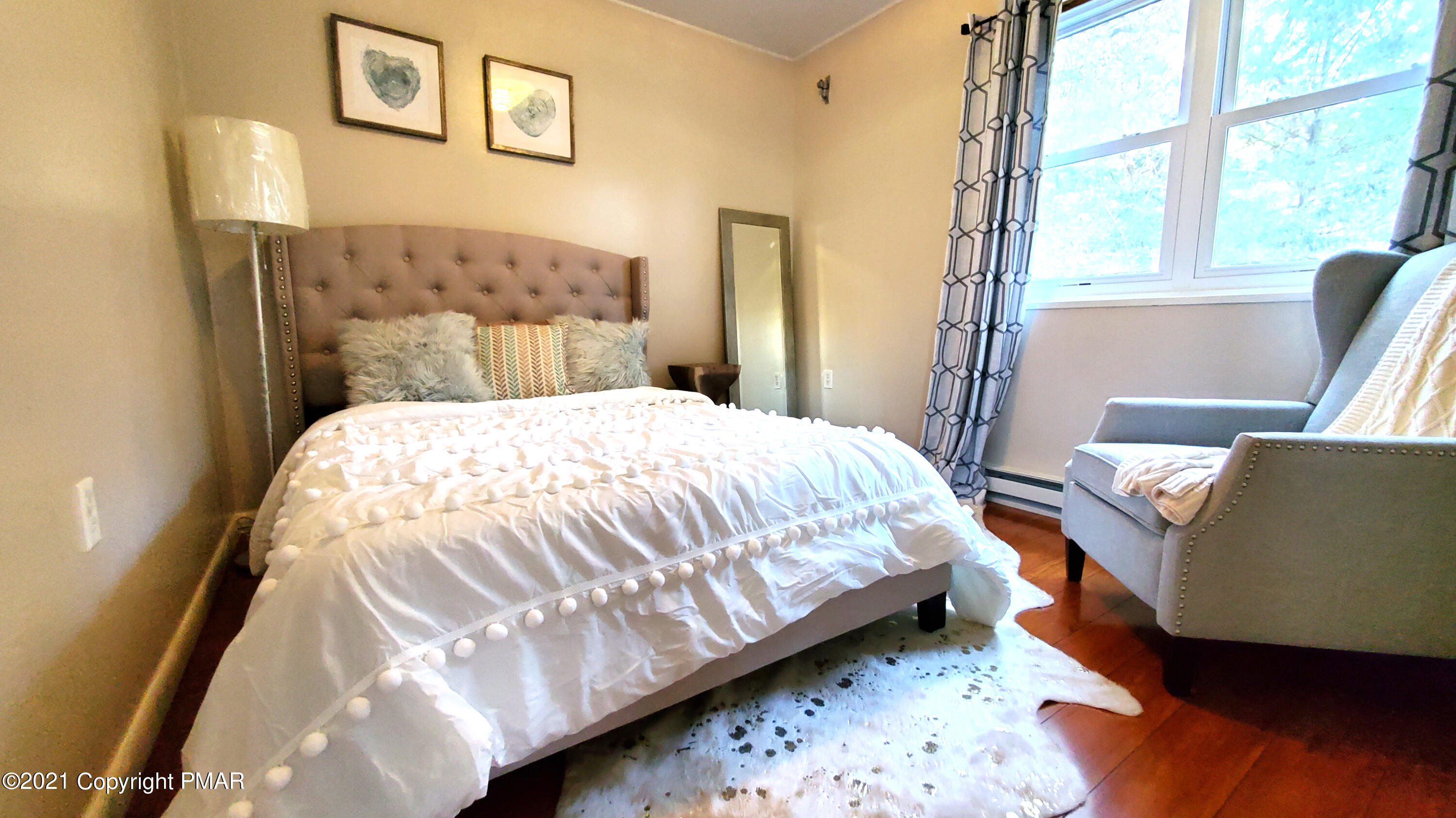 2111 Southport Drive Bushkill, PA 18324 - Photo 10 of 30 a bedroom with a bed and wooden floor