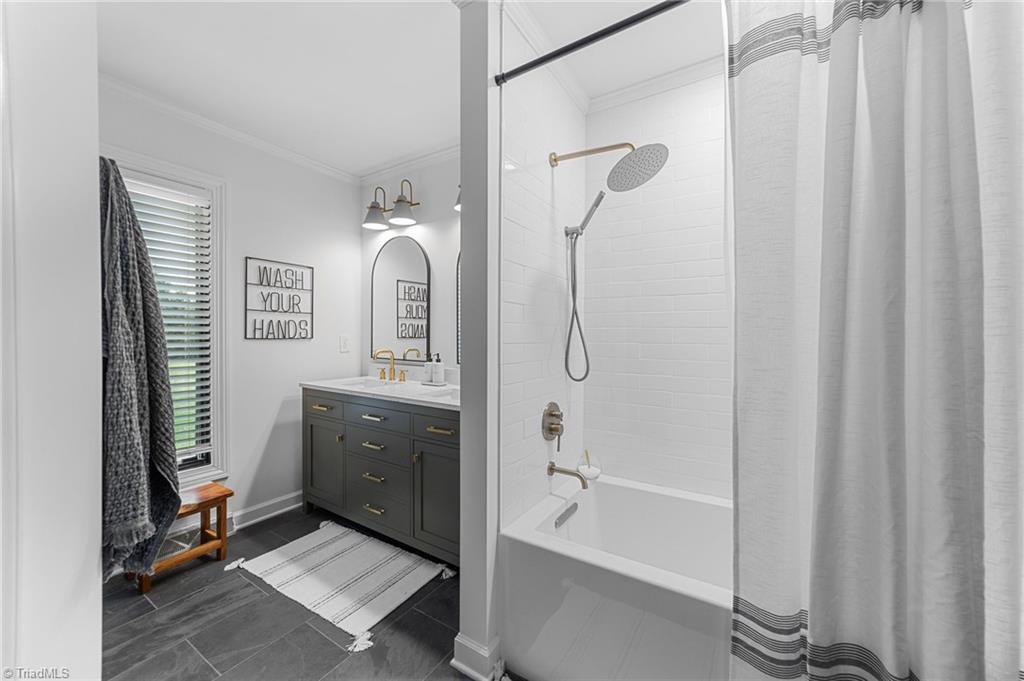 8320 West Harrell Road Oak Ridge, NC 27310 - Photo 27 of 50 Full hall bathroom on east wing of home remodeled Aug '23