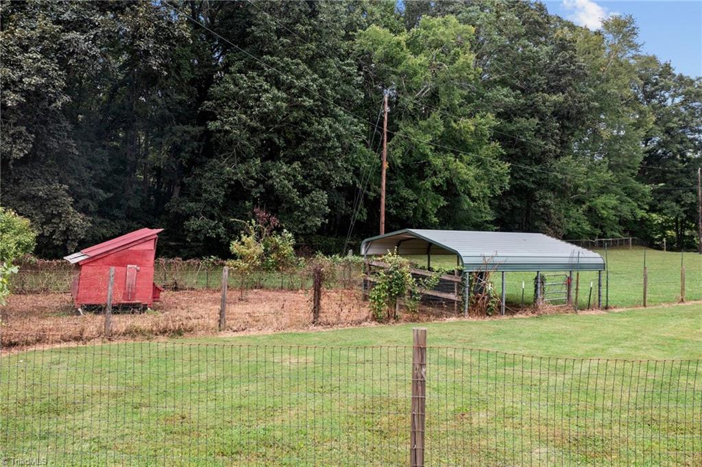 8320 West Harrell Road Oak Ridge, NC 27310 - Photo 46 of 50 Chicken yard with coop and run in