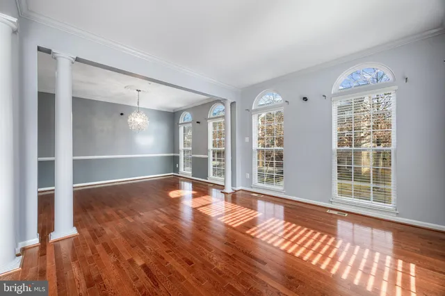 a view of a kitchen with a sink hardwood floor and a window