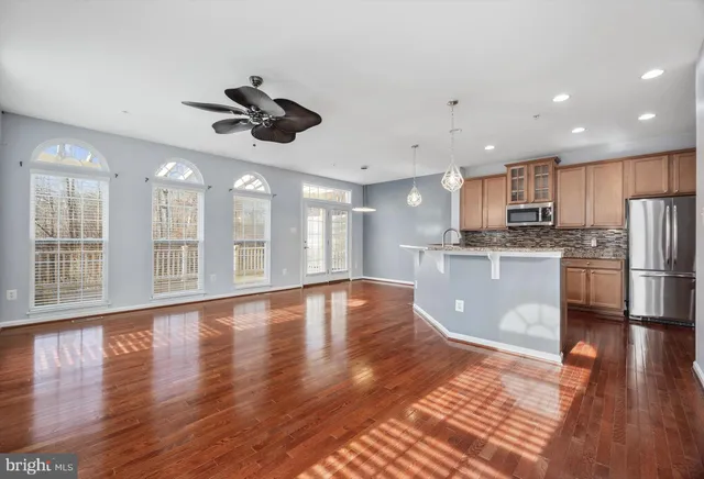 a view of kitchen with cabinets and wooden floor