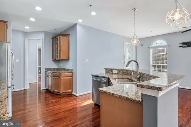 a bathroom with a sink a mirror and toilet
