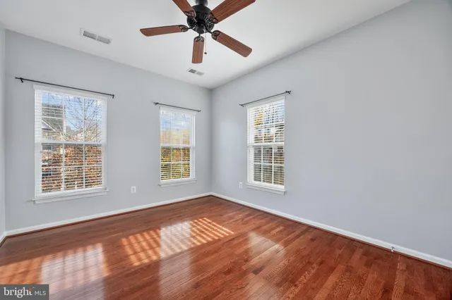 a bathroom with a sink toilet and a mirror