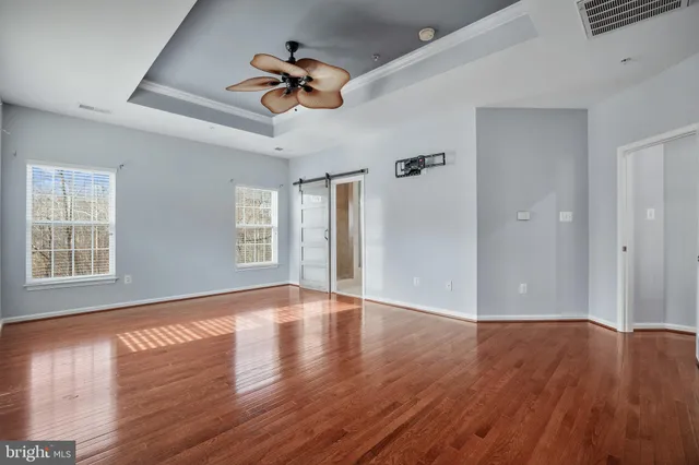 a bathroom with a granite countertop sink a mirror and a vanity