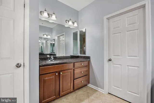 a view of a house with a wooden deck