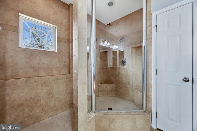 a view of a swimming pool and lounge chairs