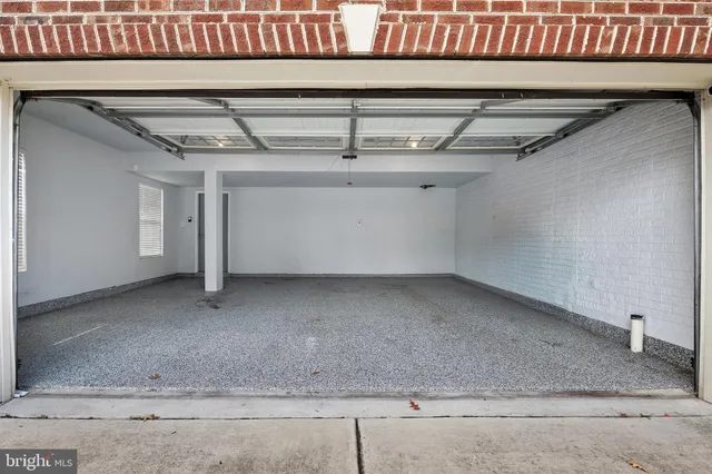 a view of a backyard with chairs and a patio