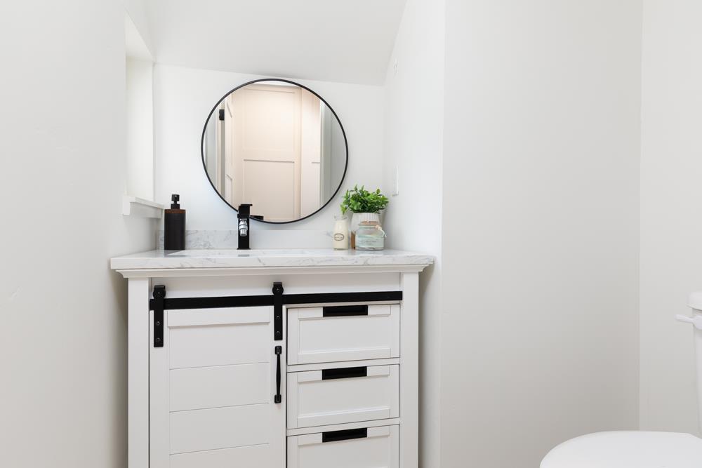 103 Staggi Lane Soquel, CA 95073 - Photo 26 of 35 a bathroom with a sink and a mirror