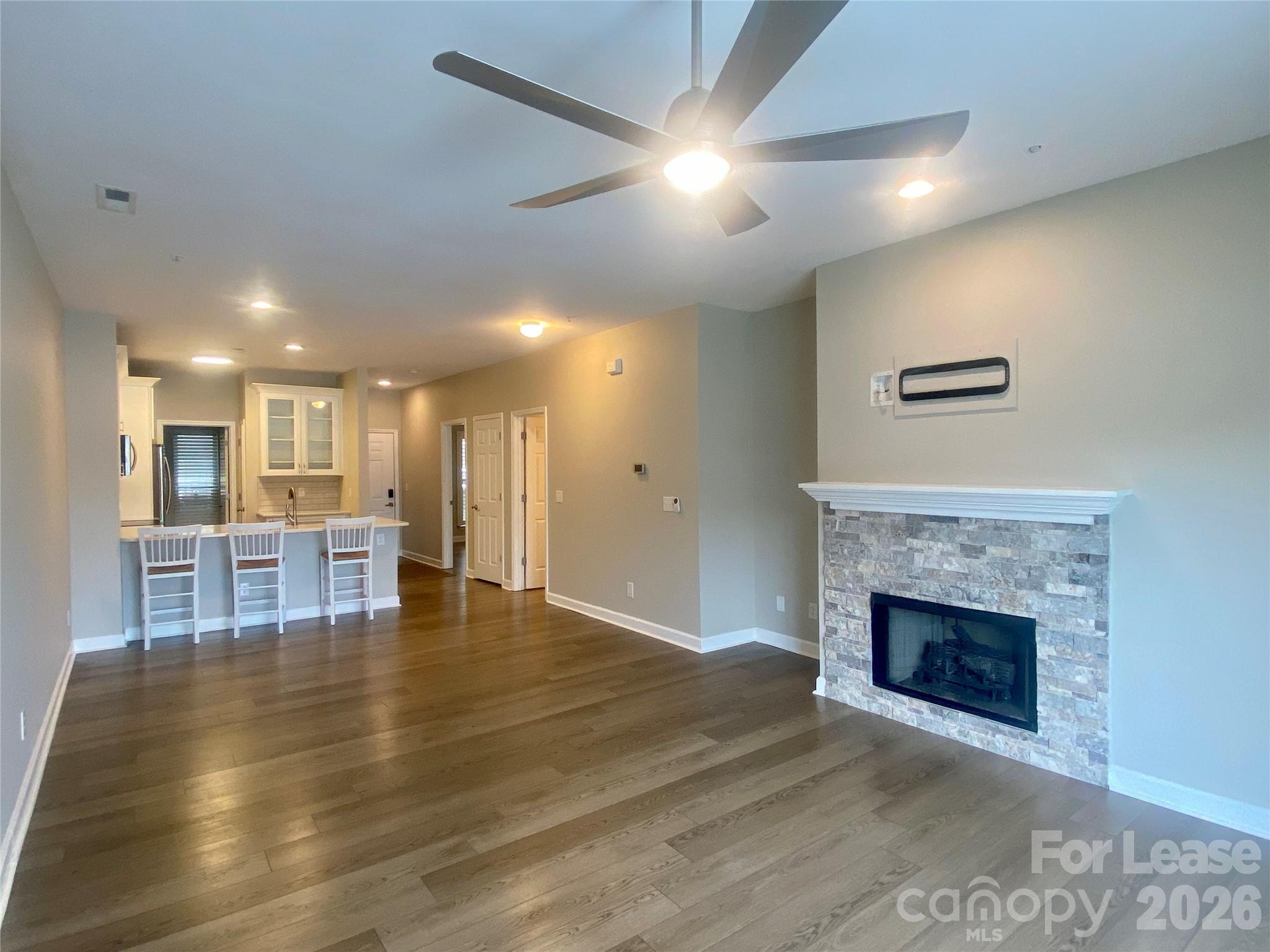 920 Jetton Street, Unit 49 Davidson, NC 28036 - Photo 14 of 33 a view of kitchen with furniture and fireplace