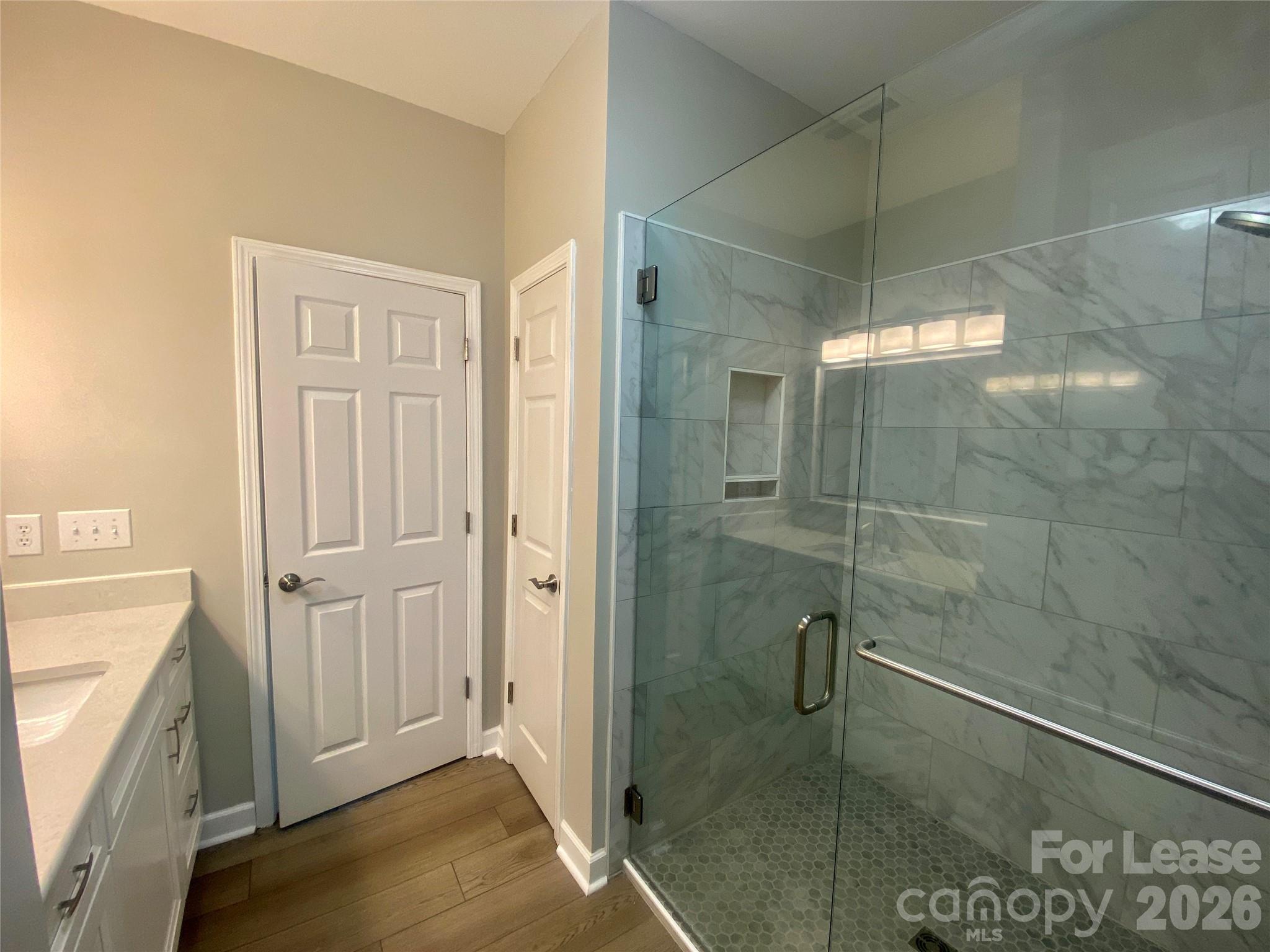 920 Jetton Street, Unit 49 Davidson, NC 28036 - Photo 21 of 33 a bathroom with a shower