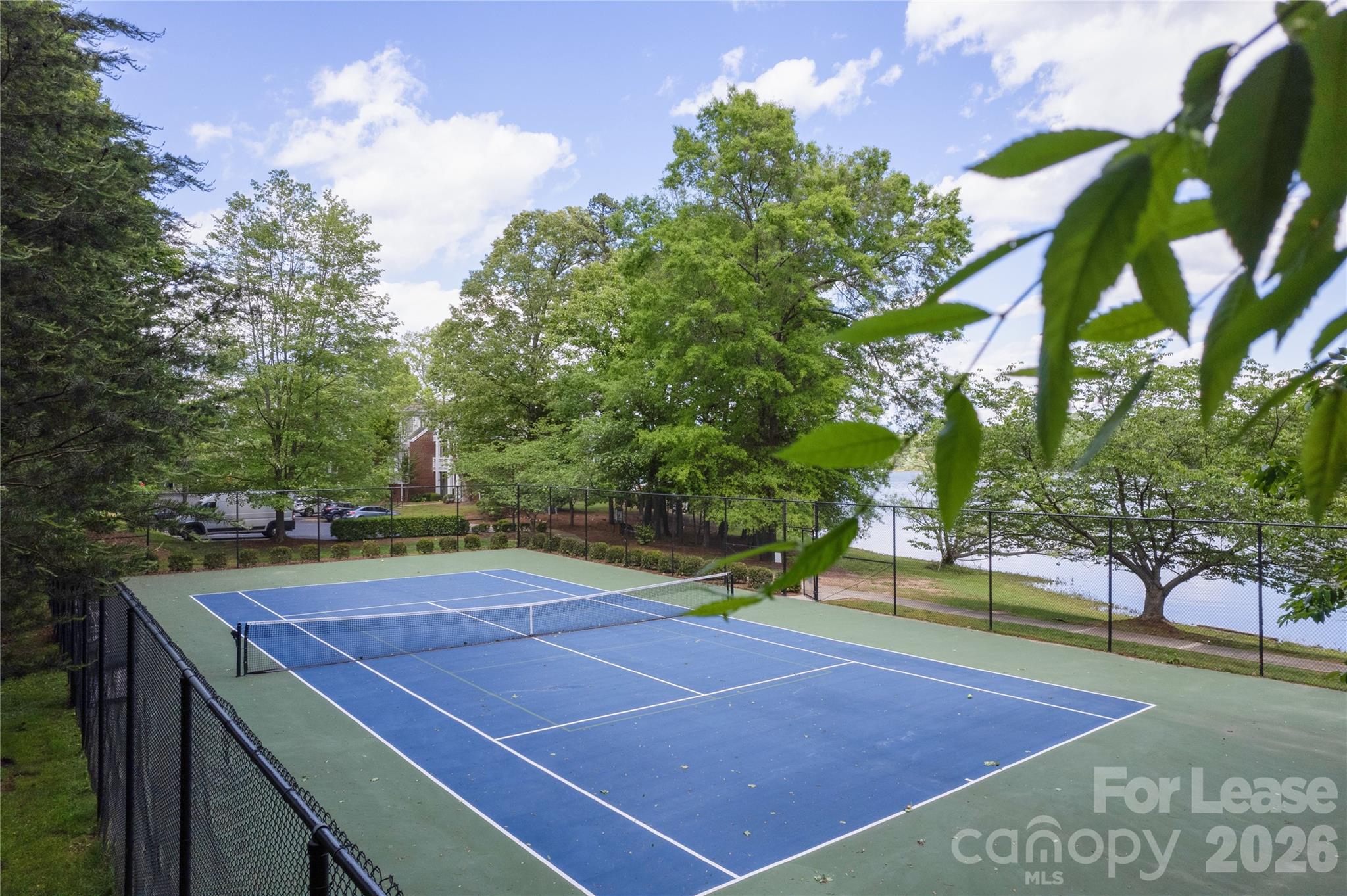 920 Jetton Street, Unit 49 Davidson, NC 28036 - Photo 30 of 33 a view of a tennis court