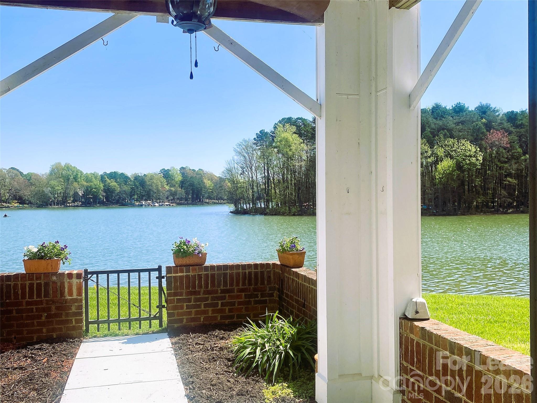 920 Jetton Street, Unit 49 Davidson, NC 28036 - Photo 3 of 33 a view of a lake from a balcony