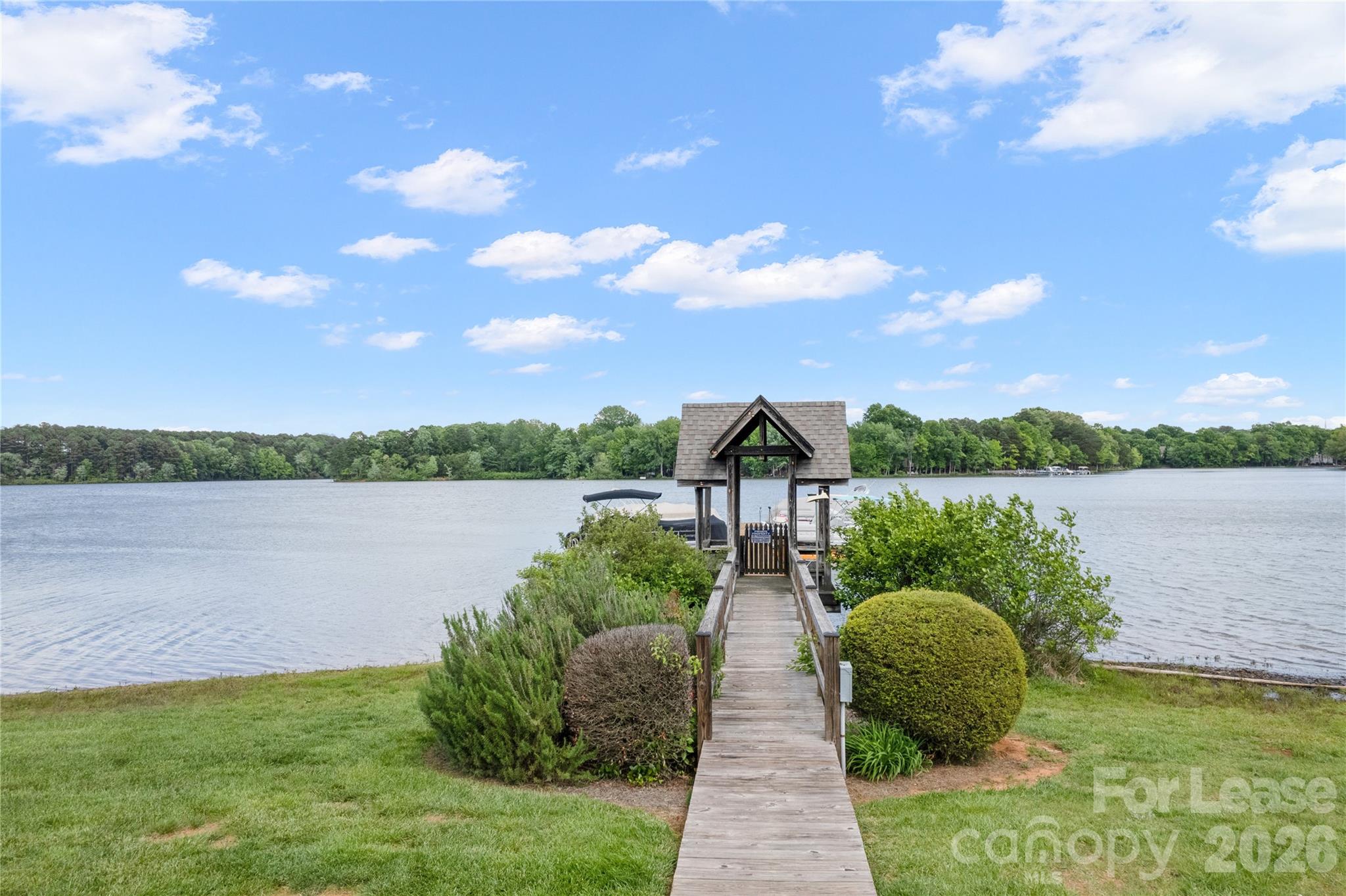 920 Jetton Street, Unit 49 Davidson, NC 28036 - Photo 31 of 33 a view of a lake with a big yard