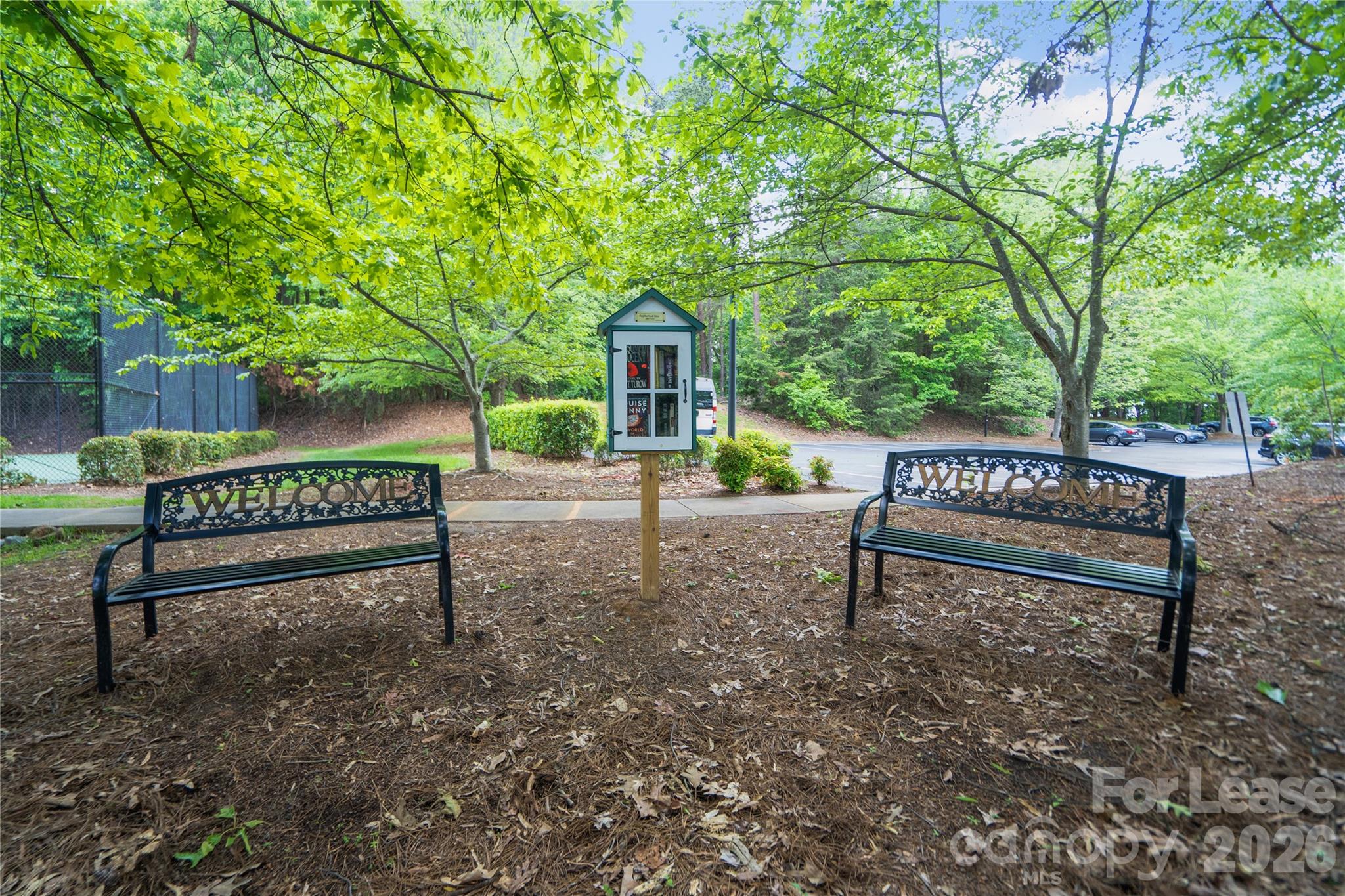 920 Jetton Street, Unit 49 Davidson, NC 28036 - Photo 33 of 33 a view of a bench in a garden