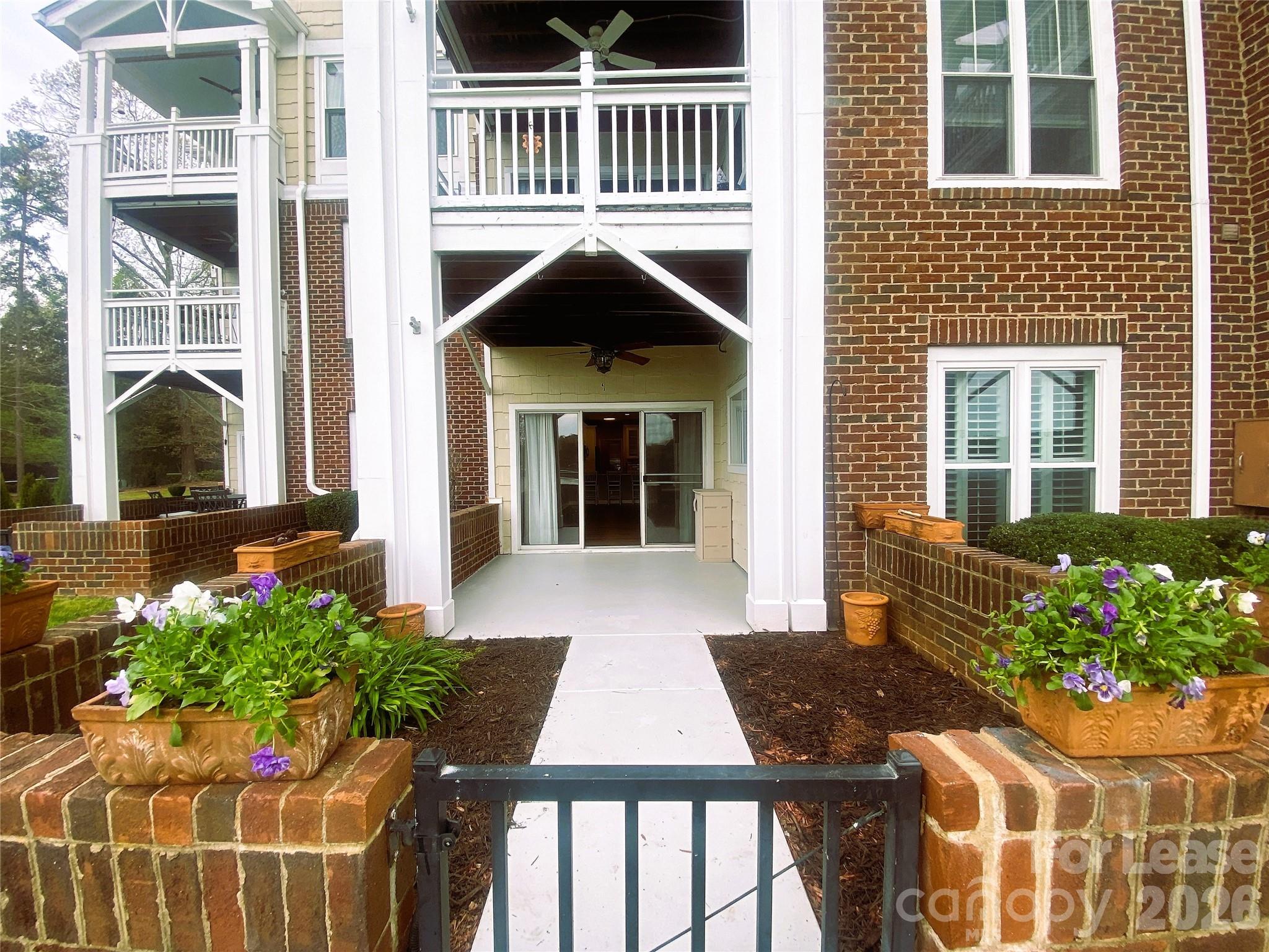 920 Jetton Street, Unit 49 Davidson, NC 28036 - Photo 6 of 33 a front view of a house with a yard