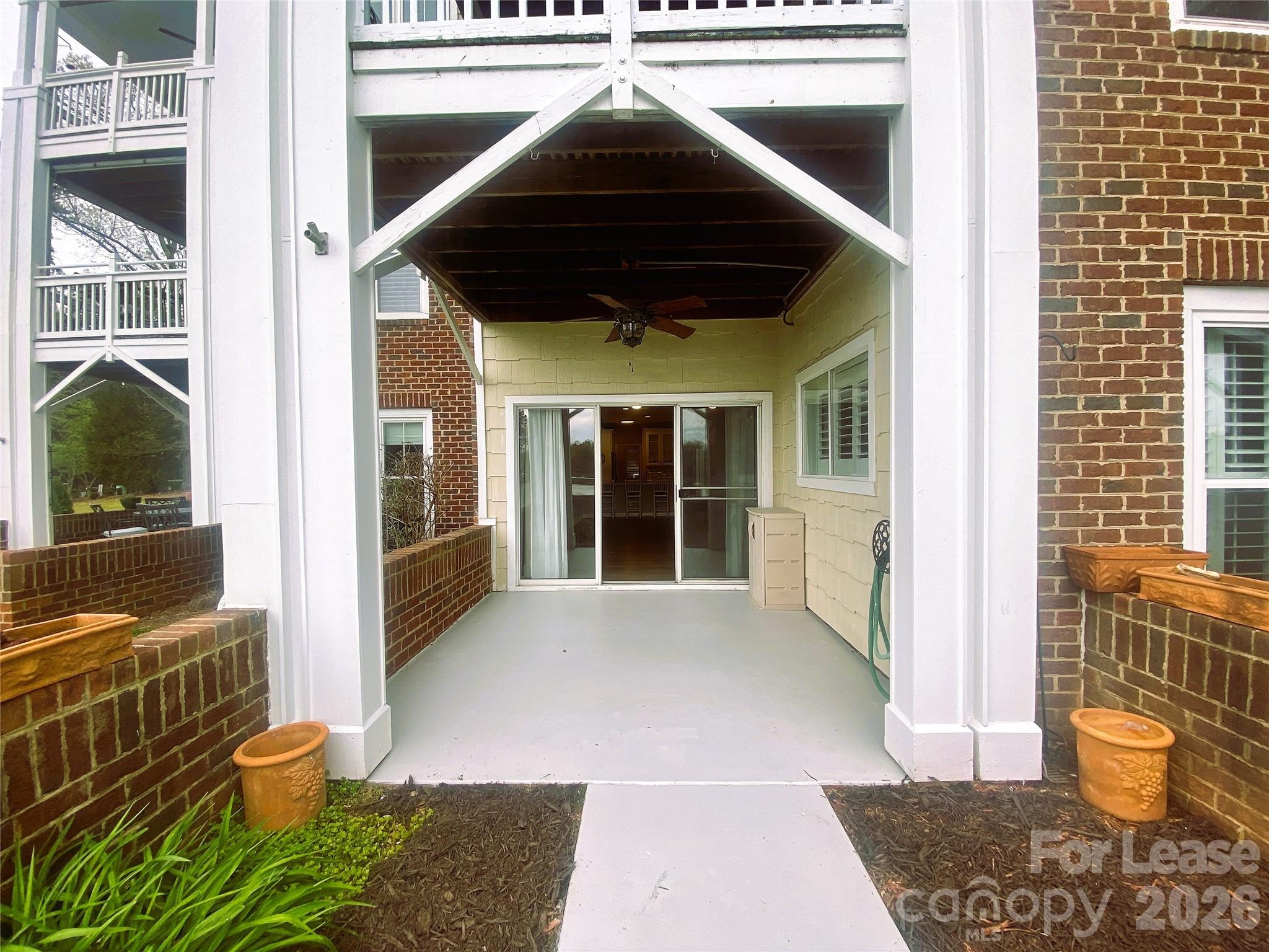 920 Jetton Street, Unit 49 Davidson, NC 28036 - Photo 7 of 33 a front view of a house with a yard