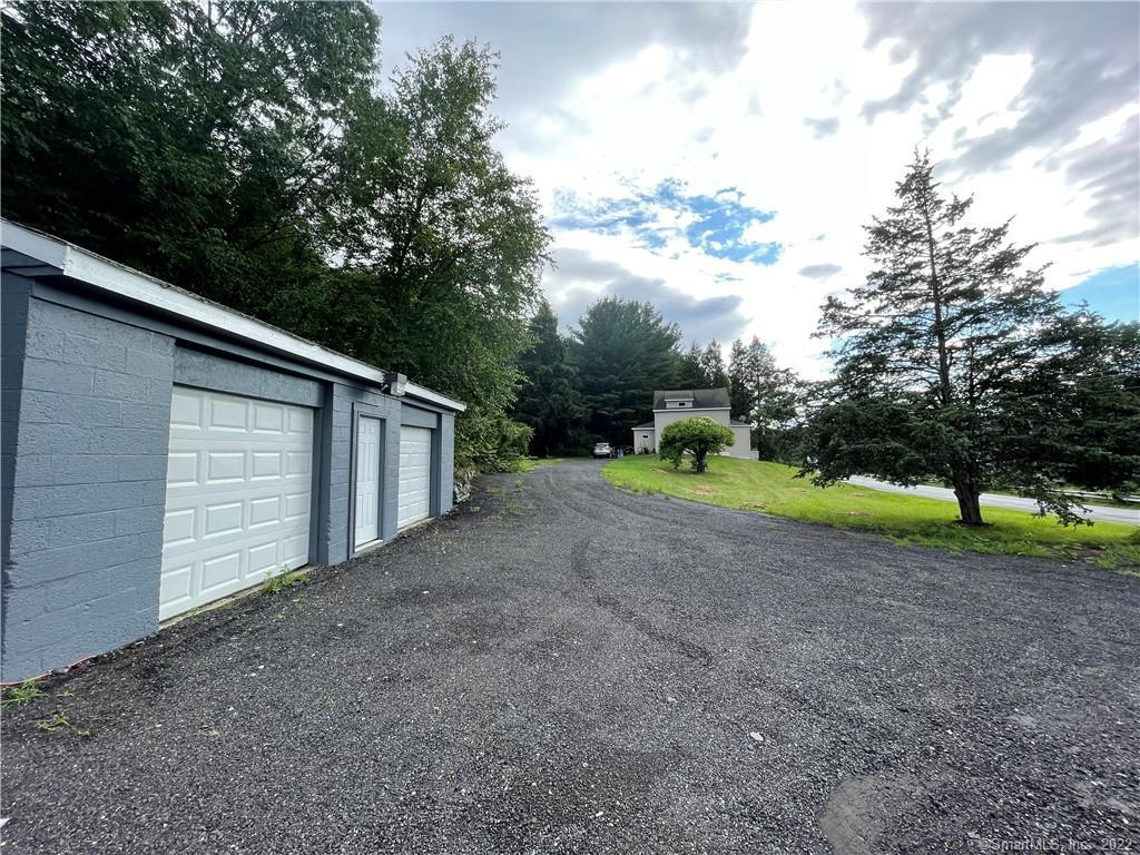 98 Woodtick Road Wolcott, CT 06716 - Photo 1 of 1 a view of a house with a backyard