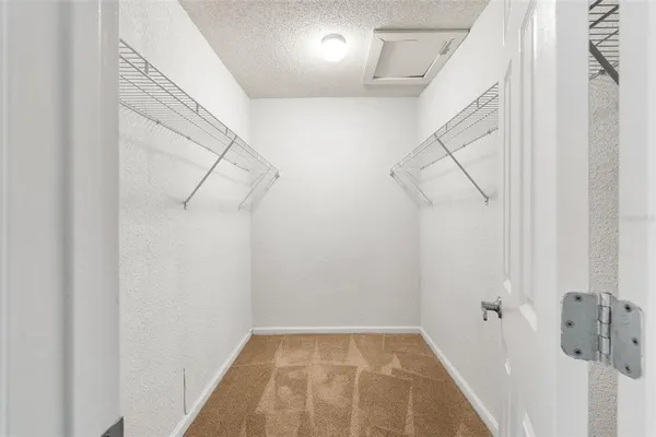 a view of a room with racks on the wall