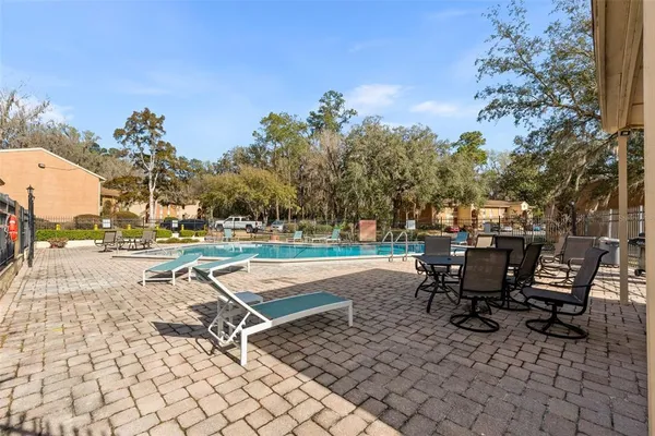 a view of a backyard with sitting area