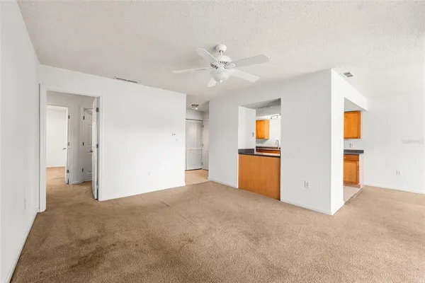 a view of a kitchen with wooden floor and cabinet