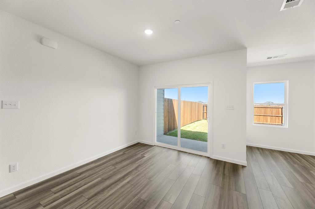 1444 Lake Alpine Trail Anna, TX 75409 - Photo 13 of 29 an empty room with wooden floor and windows
