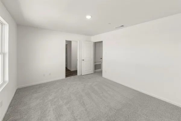 a bathroom with a shower sink and mirror